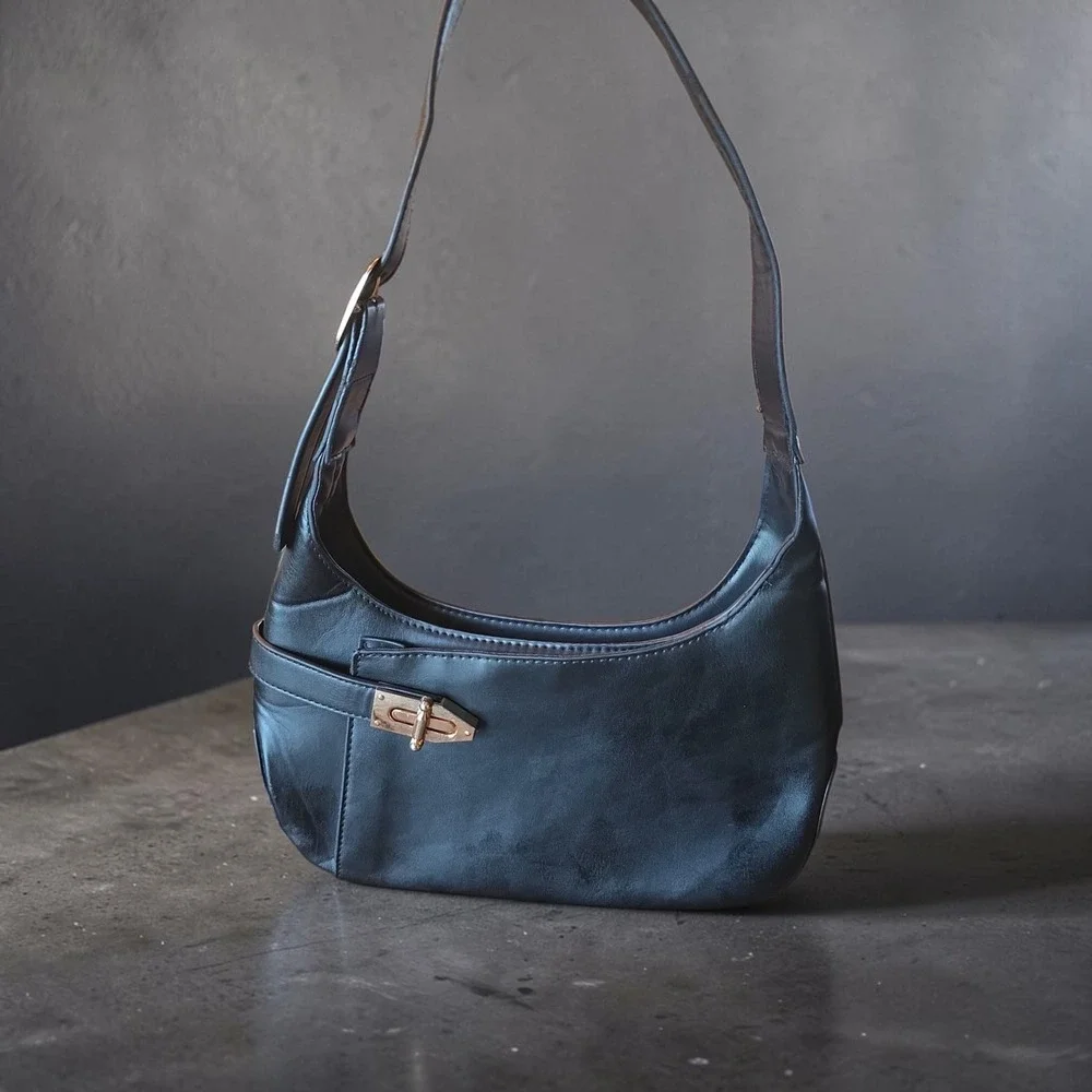 Minimalist black hobo shoulder bag gold hardware under arm‎